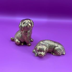 Two vintage brass puppies.